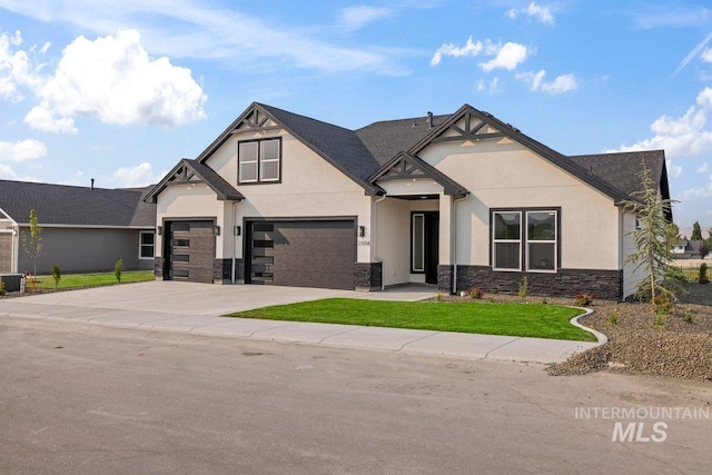 craftsman-style home with central AC and a garage