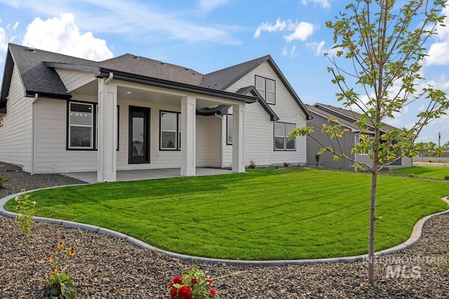 exterior space featuring a yard and a patio