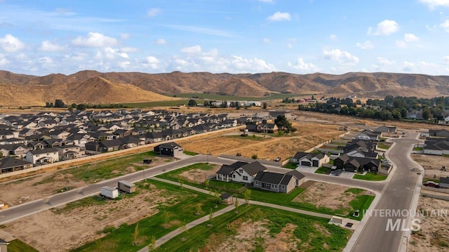 drone / aerial view featuring a mountain view