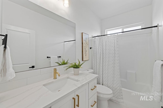 full bathroom with vanity, toilet, shower / bath combo with shower curtain, and backsplash