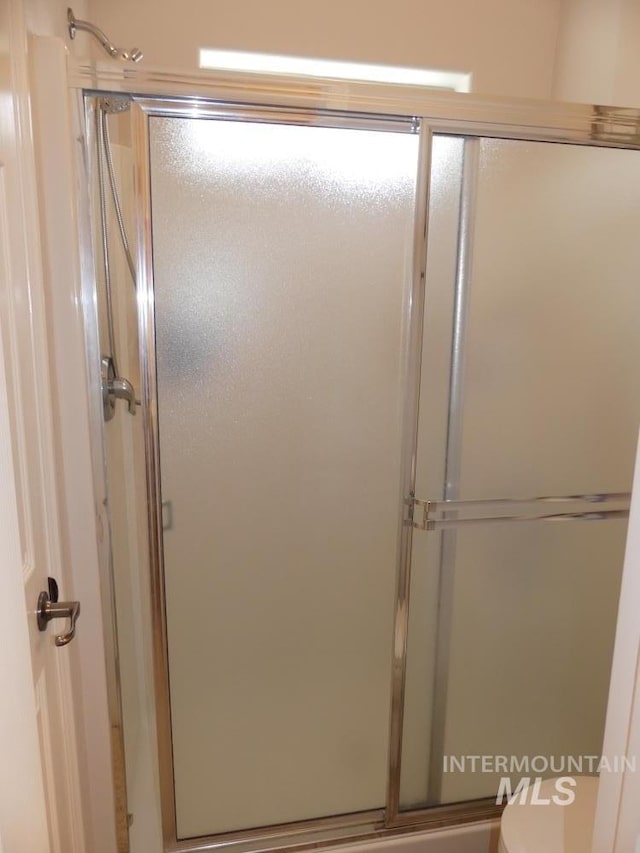 24 Mangum Dr Unit 1, Donnelly, ID 83615 - bathroom featuring a shower with door and toilet