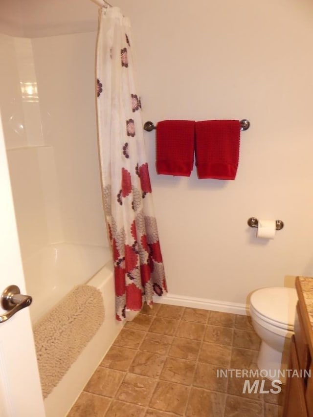 24 Mangum Dr Unit 1, Donnelly, ID 83615 - full bathroom with vanity, toilet, shower / bath combination with curtain, and baseboards
