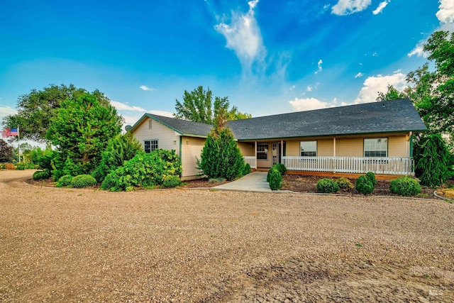 ranch-style home with covered porch