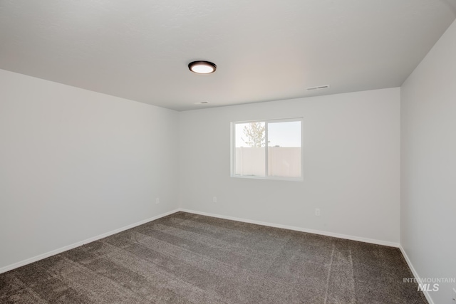 spare room featuring carpet flooring