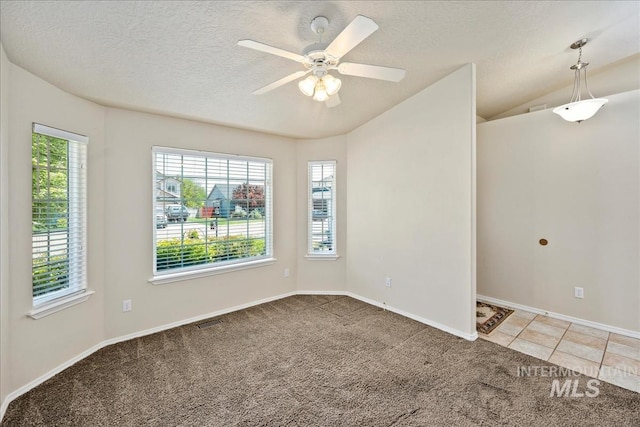 3804 Stonehedge Way, Caldwell, ID 83605 - unfurnished room featuring light colored carpet, ceiling fan, a textured ceiling, and vaulted ceiling