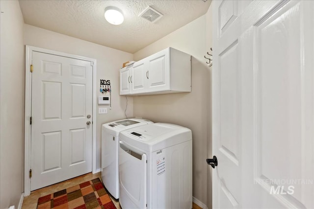 3804 Stonehedge Way, Caldwell, ID 83605 - washroom with independent washer and dryer, cabinet space, a textured ceiling, and light floors