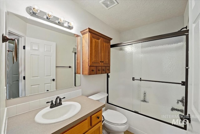 3804 Stonehedge Way, Caldwell, ID 83605 - bathroom with vanity, bath / shower combo with glass door, and a textured ceiling