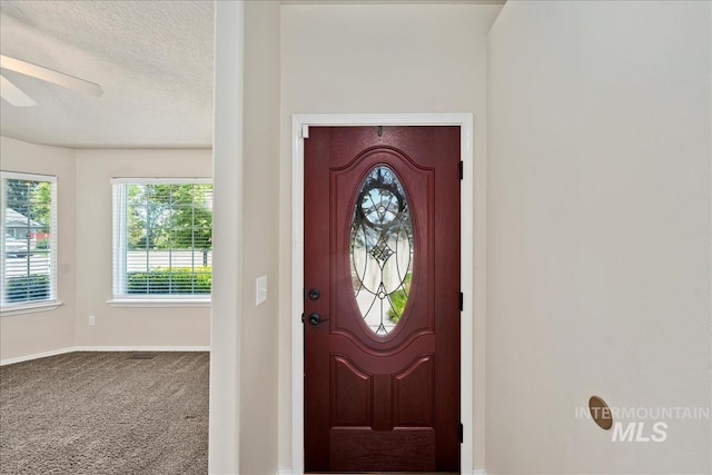 3804 Stonehedge Way, Caldwell, ID 83605 - carpeted entryway featuring a ceiling fan and a textured ceiling