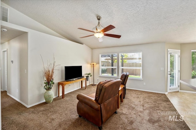 3804 Stonehedge Way, Caldwell, ID 83605 - carpeted living room featuring a ceiling fan, a textured ceiling, and vaulted ceiling