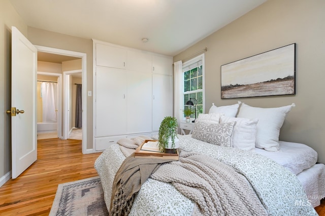 bedroom with light hardwood / wood-style floors