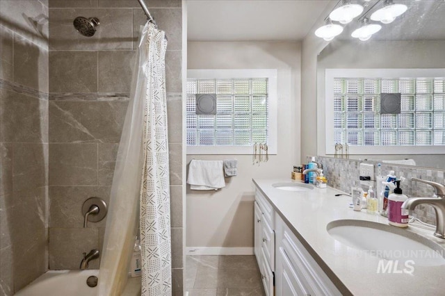 1207 N 19th St, Boise, ID 83702 - bathroom with double vanity, shower / bath combo, baseboards, and tile patterned flooring