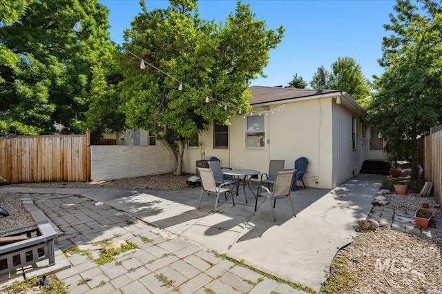 1207 N 19th St, Boise, ID 83702 - fenced backyard with a patio and outdoor dining area