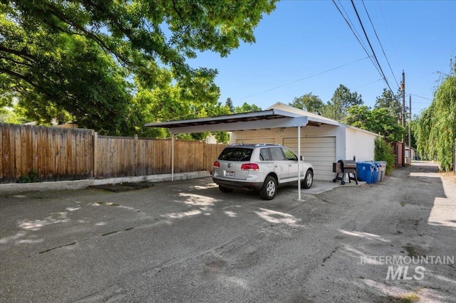 1207 N 19th St, Boise, ID 83702 - view of parking / parking lot with a garage