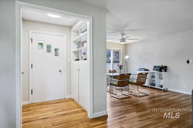 1207 N 19th St, Boise, ID 83702 - entrance foyer featuring a ceiling fan, light wood-style floors, and baseboards