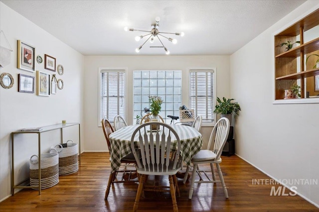 1207 N 19th St, Boise, ID 83702 - dining room with a chandelier, wood finished floors, and baseboards