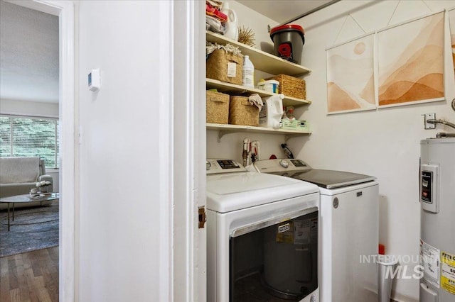 1207 N 19th St, Boise, ID 83702 - laundry room with water heater, washing machine and clothes dryer, and wood finished floors