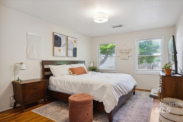 1207 N 19th St, Boise, ID 83702 - bedroom featuring wood finished floors and baseboards