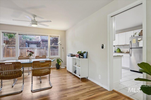 1207 N 19th St, Boise, ID 83702 - dining space featuring a ceiling fan, light wood-style flooring, and baseboards