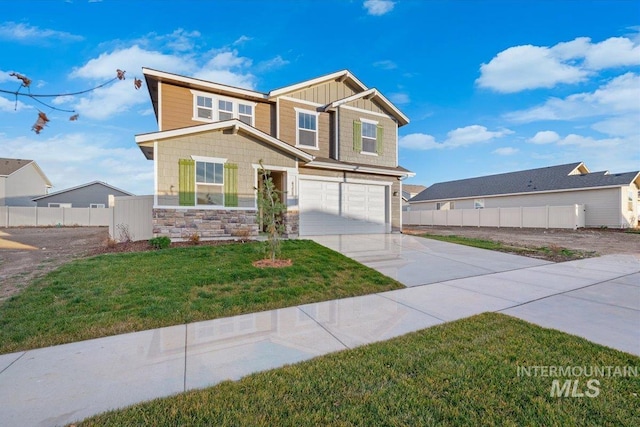 view of front of house with a front yard and a garage