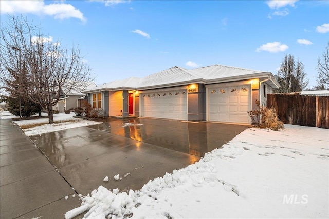 single story home featuring a garage