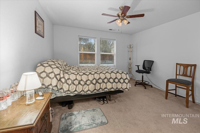 carpeted bedroom featuring ceiling fan