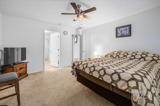 bedroom with light carpet and ceiling fan