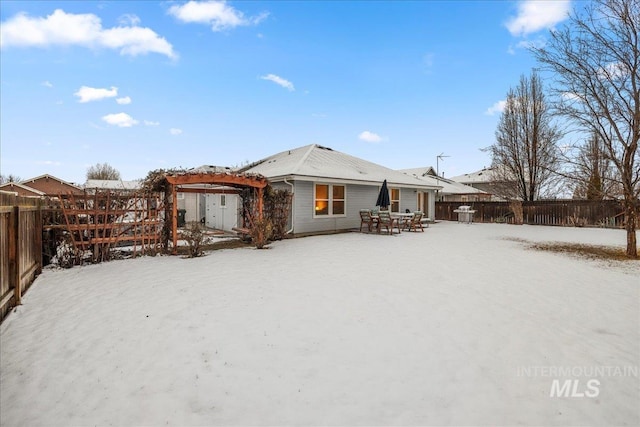 view of snow covered house