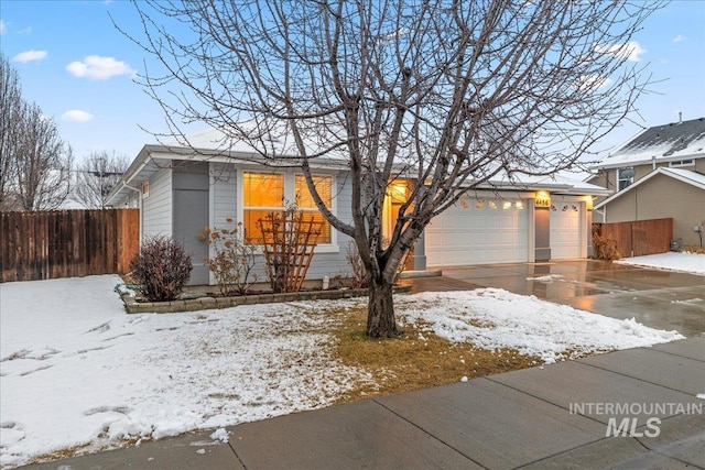 view of front of property with a garage