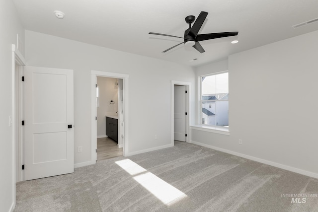 2827 N Rocky Bottom Way, Kuna, ID 83634 - unfurnished bedroom featuring carpet floors, baseboards, connected bathroom, and ceiling fan