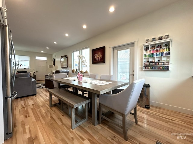 dining room with recessed lighting, light wood-type flooring, and baseboards