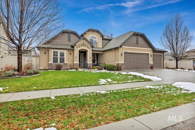 view of front facade with a garage and a front lawn