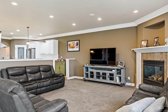 living room with crown molding and light carpet