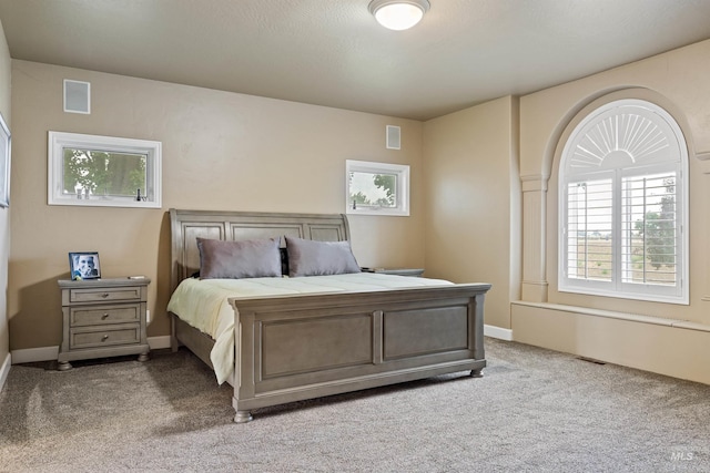 bedroom featuring light colored carpet