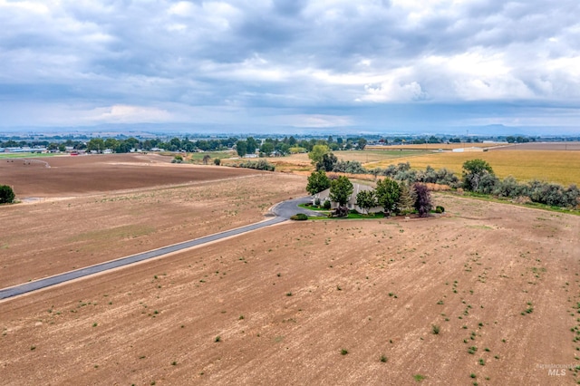 birds eye view of property with a rural view