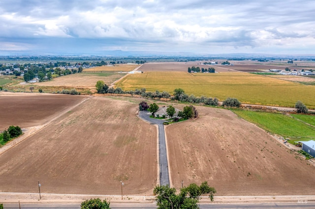 birds eye view of property with a rural view