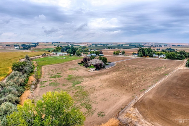 birds eye view of property featuring a rural view