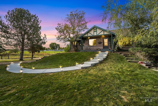 view of front of property with a lawn