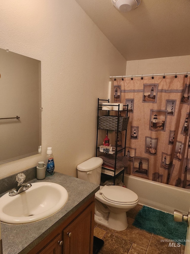 full bathroom featuring toilet, vanity, shower / tub combo with curtain, and tile patterned flooring