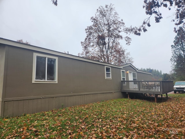 back of house featuring a deck