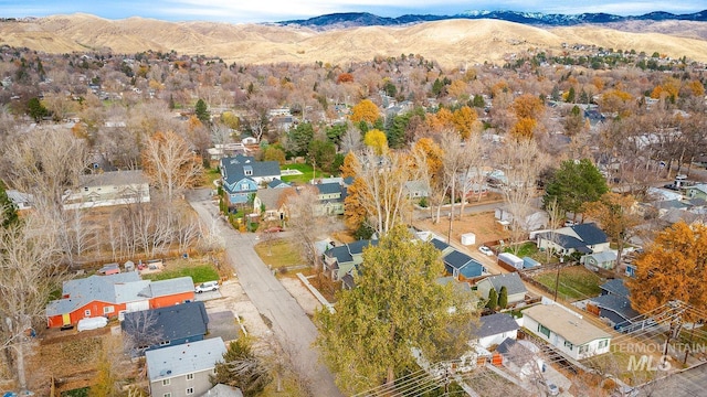 birds eye view of property with a mountain view