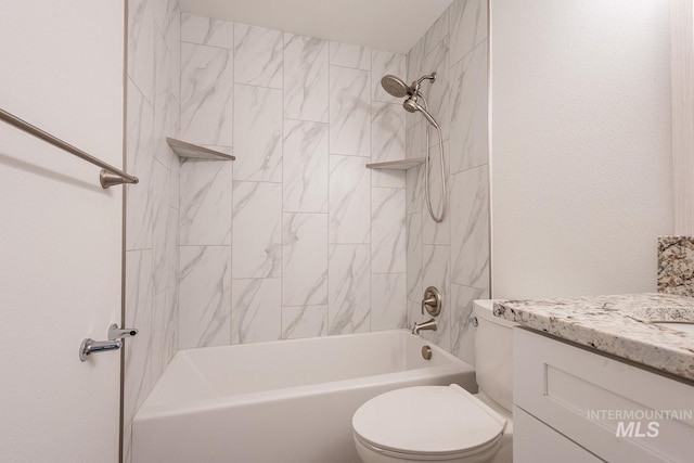 full bathroom with vanity, toilet, and tiled shower / bath combo