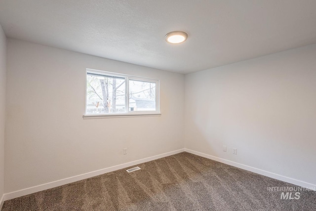 empty room featuring carpet