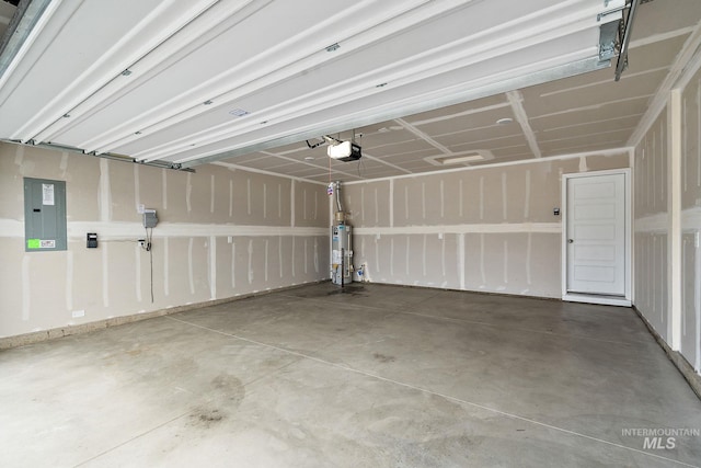 garage with electric panel, a garage door opener, and water heater