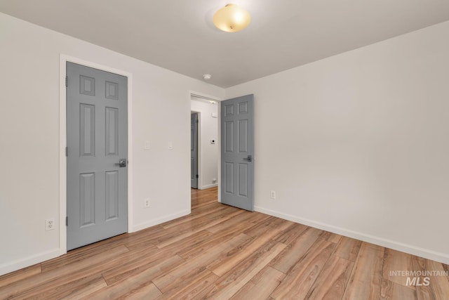 10834 W Linstock Ct, Boise, ID 83713 - unfurnished bedroom featuring light wood-style flooring and baseboards