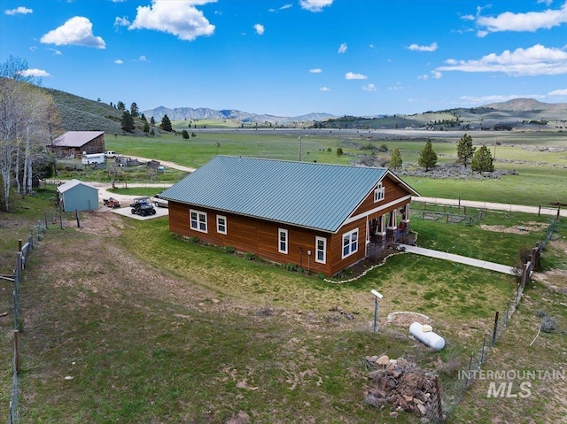 bird's eye view featuring a rural view and a mountain view