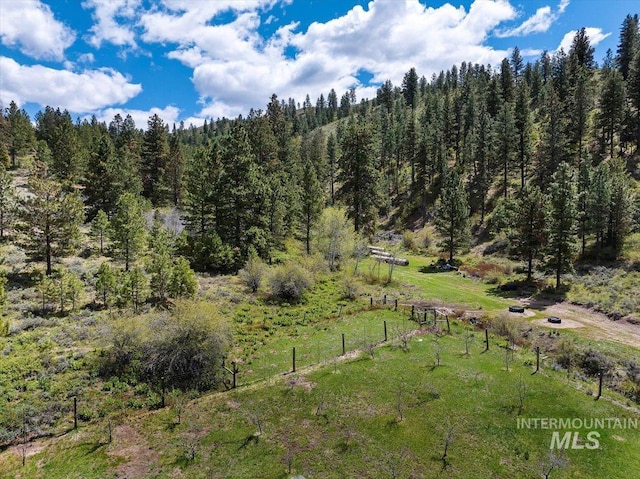 birds eye view of property with a rural view