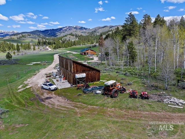 birds eye view of property with a rural view and a mountain view