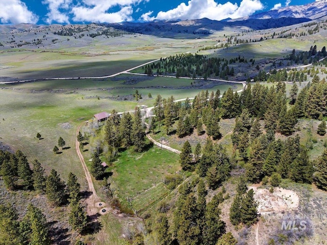 aerial view featuring a rural view and a mountain view