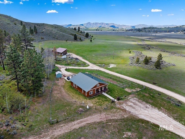 birds eye view of property with a rural view and a mountain view