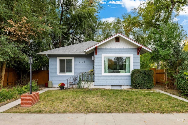 bungalow with a front yard